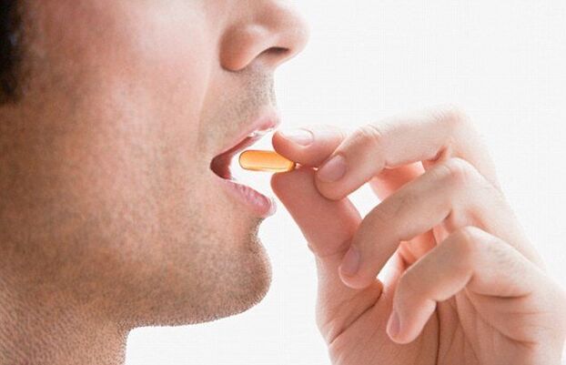 A man takes a multivitamin to maintain potency